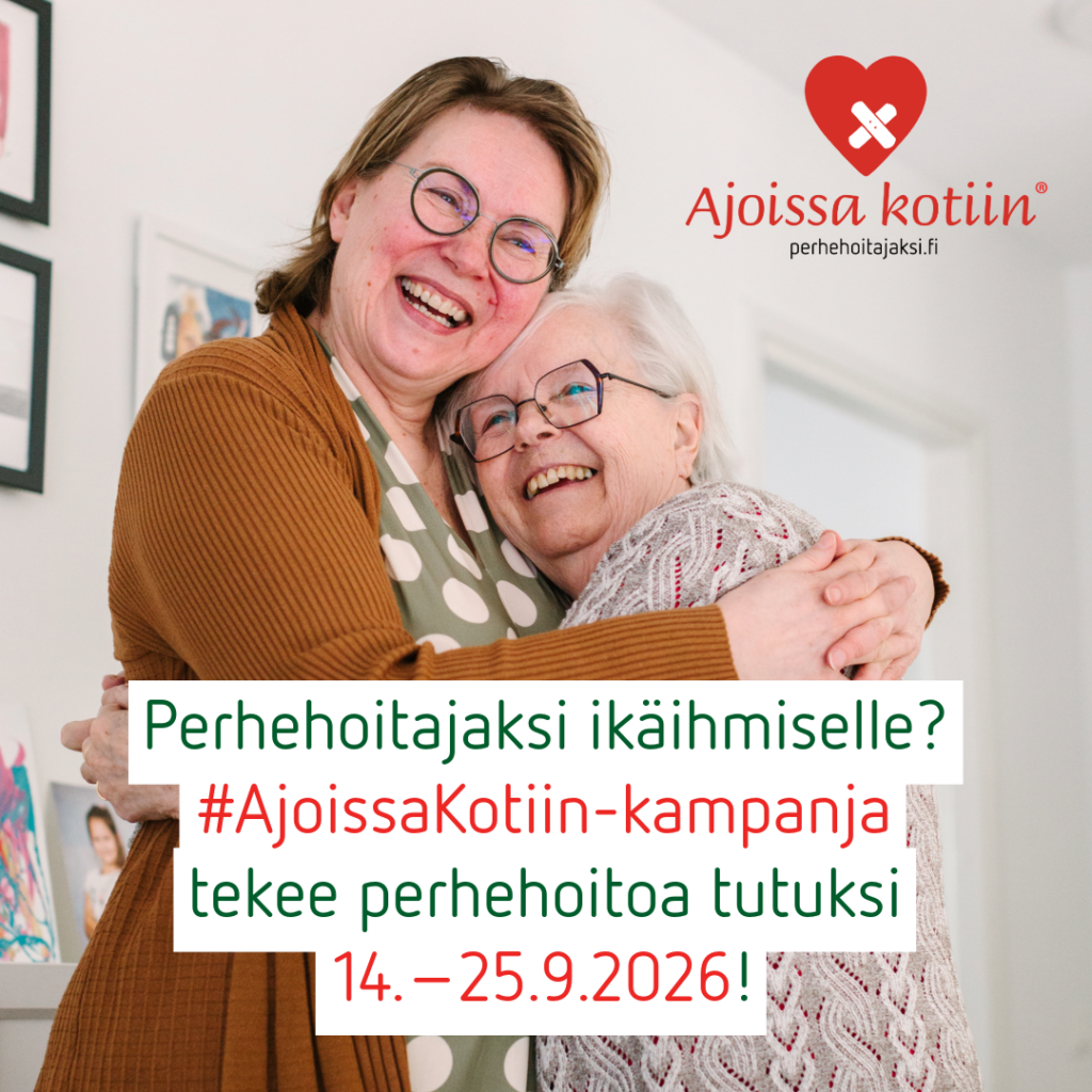 Kaksi silmälasipäistä naista halaa.