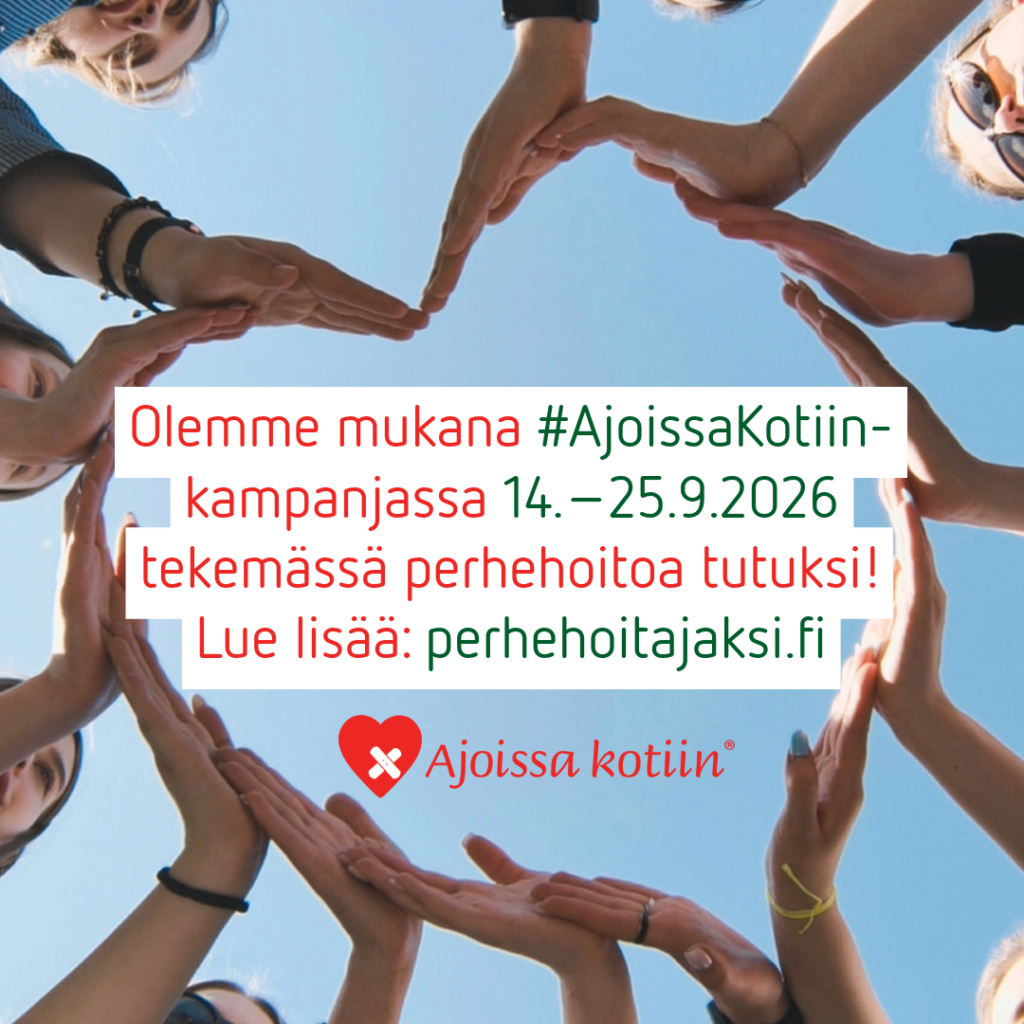 Ryhmä ihmisiä muodostaa käsillään sydämenmuotoisen kuvion ilmaan.